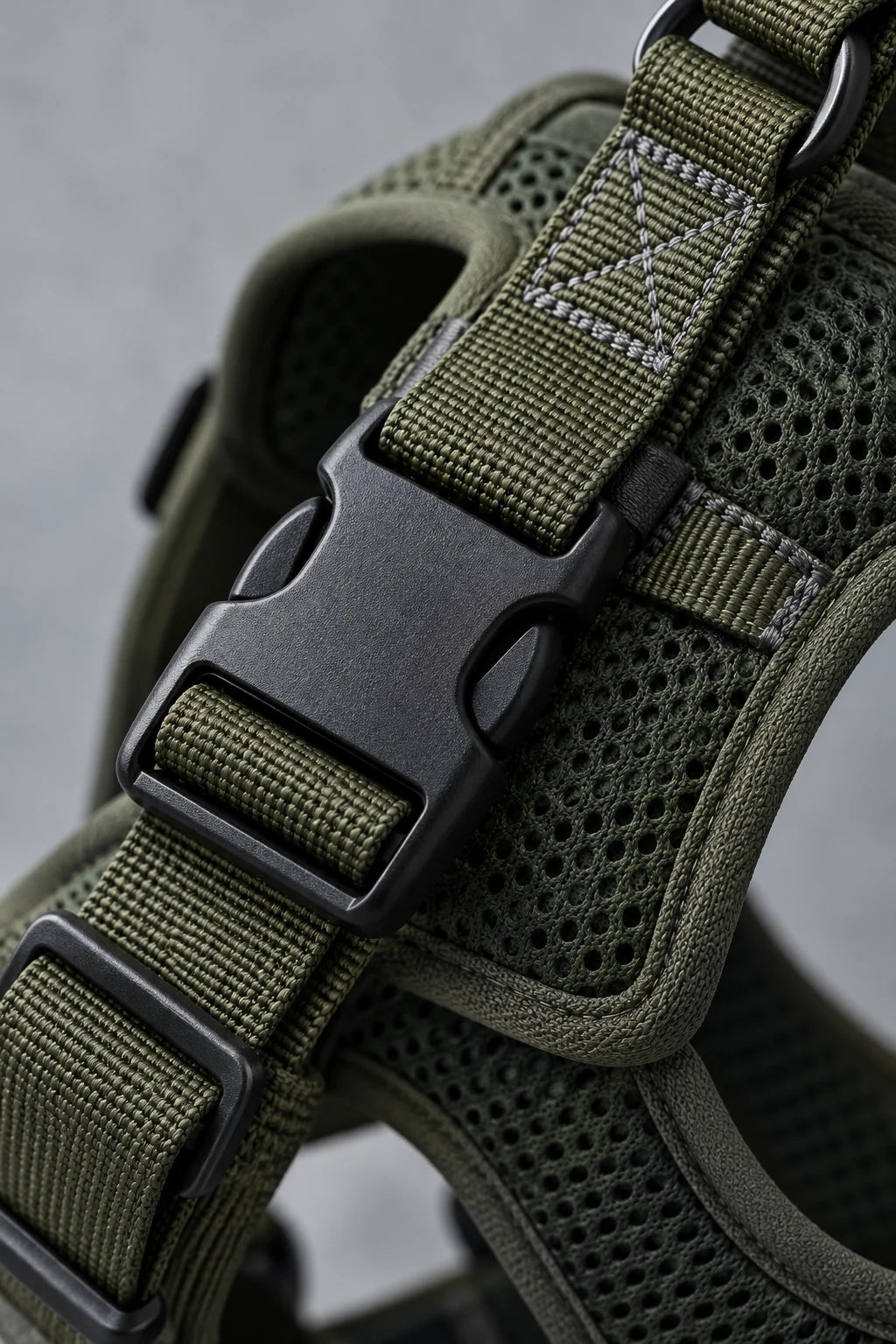 Olive harness buckle and webbing detail